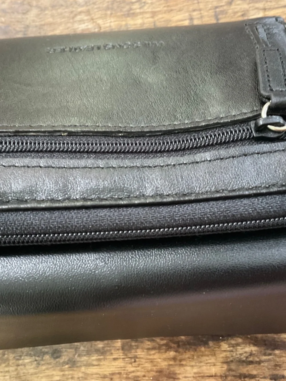 Wilson’s black leather wallet